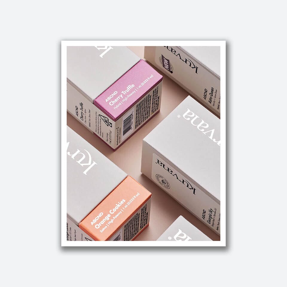 kurvana-social-digital-media | Kurvana | Curated for years. Experienced in moments. Close-up image of Kyvana branded CBD product boxes including Cherry Truffle and Orange Cookies flavors.